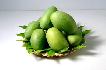 Many of Fresh green mango on white background in Basket