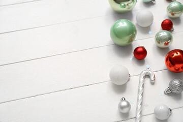 Different Christmas decorations on white wooden background