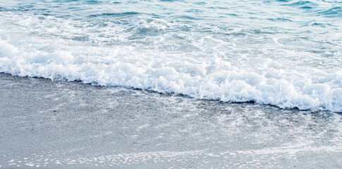 Summer seascape beautiful closeup. Mediterranean bright sea bay waves splashing beach sandy coast