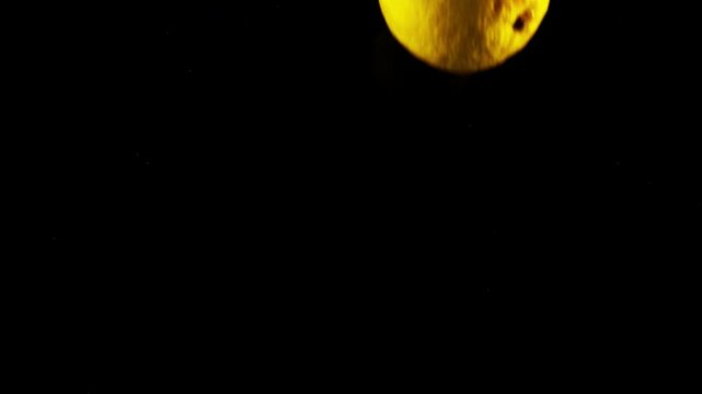 lemons plunging in water