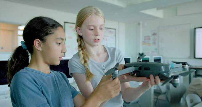 School Children in STEM Computer Classroom Looking at Drone Technology