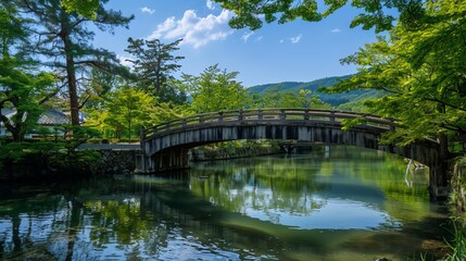 Fototapeta premium In May, the town of Akiota in Hiroshima is bursting with greenery. Explore Sandankyo near the Mizunashi parking lot. Visit landmarks like the Sandankyo Front Gate, Kurobuchi Pool, and Deai bridge.