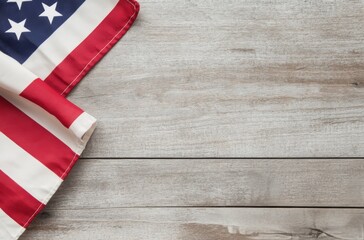 Fototapeta premium American flag draped on rustic wooden table with natural light highlighting the colors