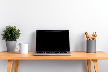 Fototapeta premium A minimalist desk with a laptop and coffee mug, set against a white wall with nothing but essentials for work