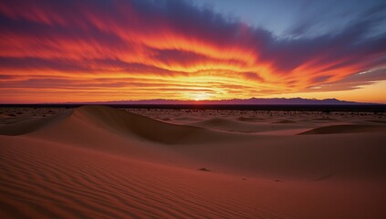 Obraz premium Stunning sunset over sprawling desert scene with glowing sand dunes and vibrant skies