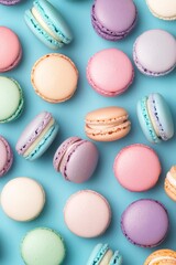 Obraz premium Colorful macarons arranged artistically on a light background in a delightful dessert display