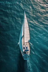 Fotobehang Aerial view of a sailboat gliding across calm blue waters on a sunny day © ArtCookStudio