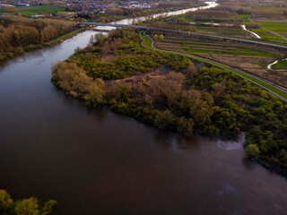 Aerial view of the Scheldt river at sunset, in East Flanders, Belgium