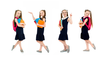 Fototapeta premium Happy cute child girl in school uniform holding books.
