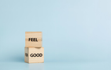 Wooden cubes with inscriptions Feel Good on a blue background