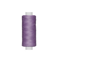 purple spool of sewing thread isolated on white background close up