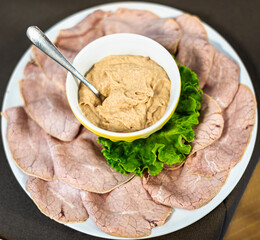 The traditional Piedmont appetizer, the Vitello tonnato. Veal slices servet with a tuna, egss and capers sauce.