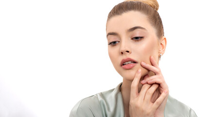Beautiful young woman with clean perfect fresh skin touching her face. Portrait of beauty model...