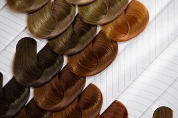 Set of hair samples with different natural color shade.  Close-up of hair color palette with a wide...