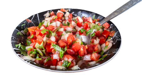 Salad of tomatoes and greens png. A deep plate with a salad and a spoon png