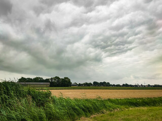 Threatening stormy sky over agricultural fields near Waddinxveen in the western part of The Netherlands.