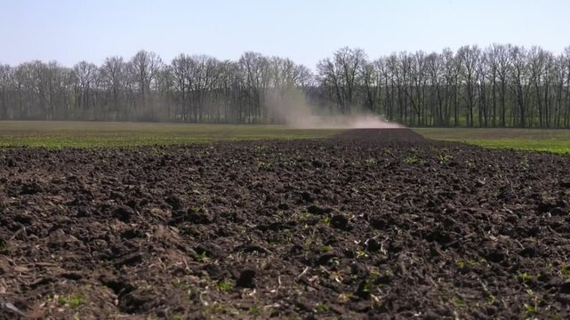 View of tractor, combine plowing cultivating agriculture field
