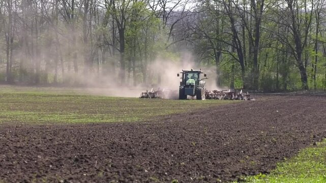 View of tractor, combine plowing cultivating agriculture field