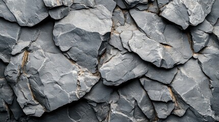 Close-up of rough grey stone texture with natural cracks, detailed rock surface, rugged background, geological formation, perfect for construction, design, and nature-related themes.
