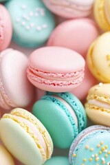 Fototapeta premium Colorful macarons arranged beautifully on a light background, showcasing a variety of pastel shades