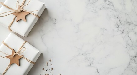 Celebratory wrapped gifts with stars and decorative elements on a marble surface