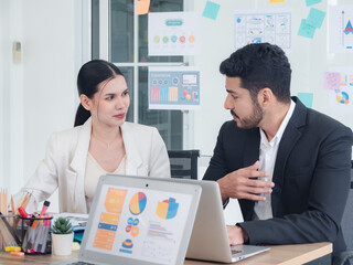 Business team woman and man asian group meeting sitting on desk looking talk think creative idea computer on table ready happy working new project job online product sale marketing in office company.
