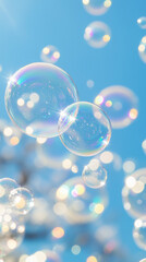 Close-up of bubbles floating in soft sunlight against blue sky