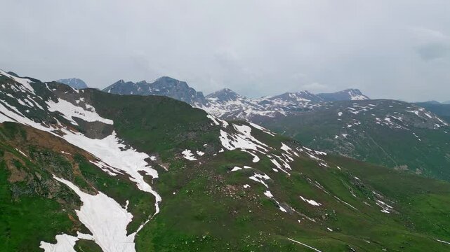 Dudipatsar Lake, a pristine blue alpine lake nestled among the snow-capped mountains of Pakistan's Kaghan Valley.