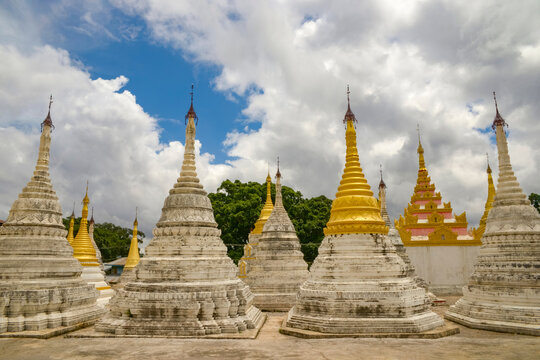 Vibrant Stupas Against Blue Sky in Pindaya