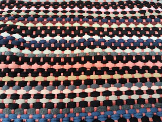 Colorful woven fabric background with textured patterns ideal for creative projects and design needs