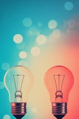 Two light bulbs glowing softly against a colorful, blurred background with bokeh effects