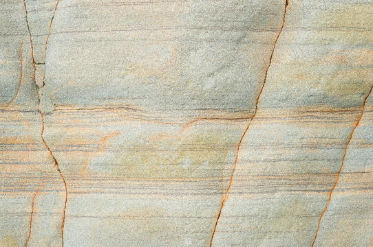 Detailed view of a natural sandstone surface with textures