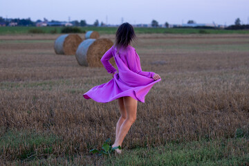Young Woman's Dance of Freedom in Windy Fields: The Harmony of Femininity and Freedom