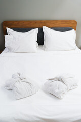 Comfortable Bed With Bathrobes For Bedtime Rest And Spa Relaxation