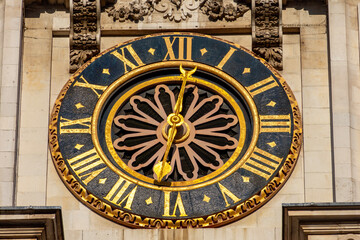 Clock (made in year 1288) on Westminster Abbey facade in London, UK