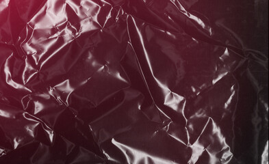 Glossy Black Plastic Texture Features a Subtle and Elegant Red Tint that Catches the Eye