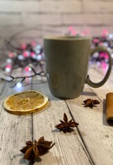 Cozy winter photo with cup of coffee and garland christmas new year mood december 