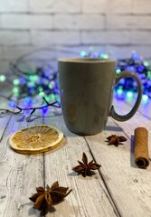 Cozy winter photo with cup of coffee and garland christmas new year mood december 