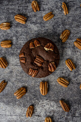 Homemade cookies with pecan nuts on a gray background