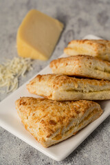 Homemade cheese scone on grey background
