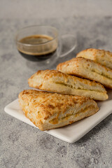 Homemade cheese scone on grey background coffee