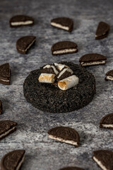 Homemade Oreo and meringue cookies on a grey background