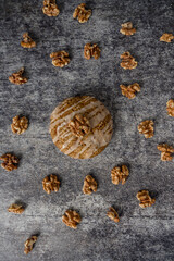 Homemade cookies with walnuts on a gray background