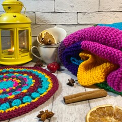 Cozy autumn photo with a flashlight, crochet doily and a knitted blanket leaves and decor fall mood...