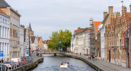 Tourists enjoying the canals in the historic center of Brugge