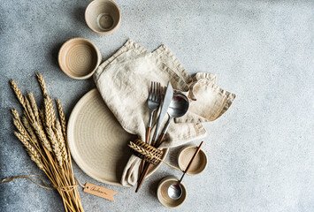 Elegant autumn table setting with natural wheat elements