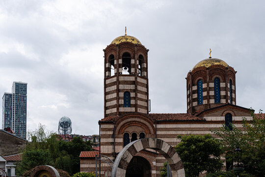 Batumi's St Nikolas Cathedral surrounded by modern buildings