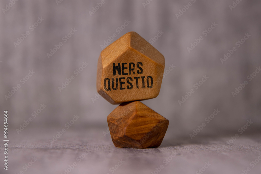 Poster a block of wood and the text wers questio