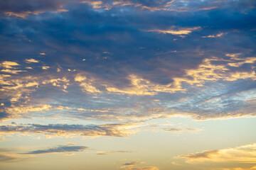 Sunlight piercing through dramatic clouds at sunrise or sunset.