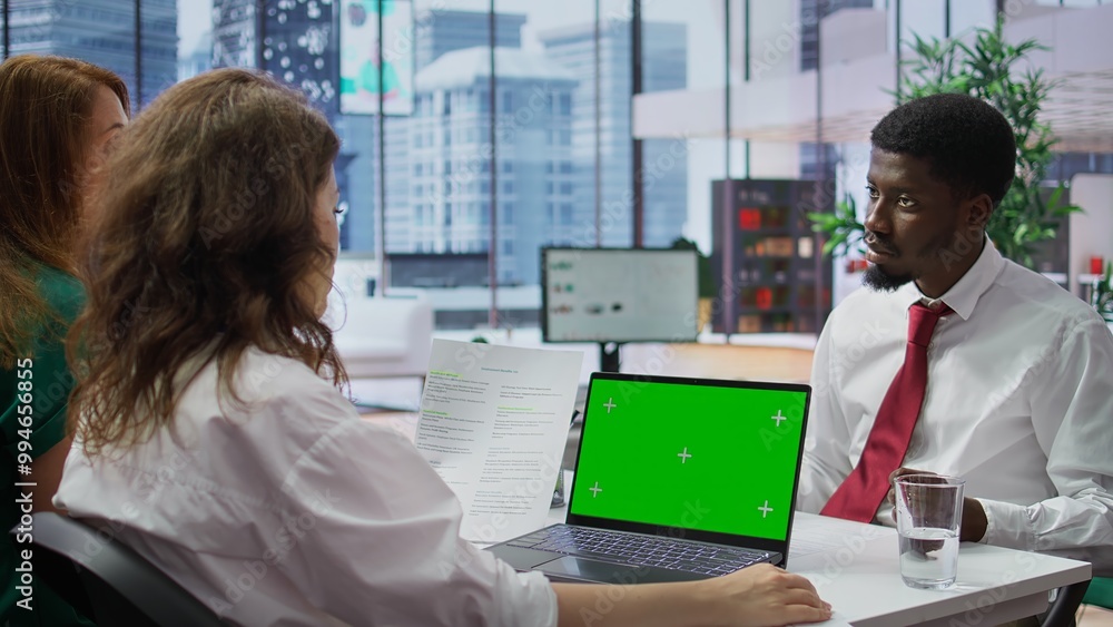 Poster hr manager doing a job interview with candidate by using laptop with chroma key mockup, asking quest